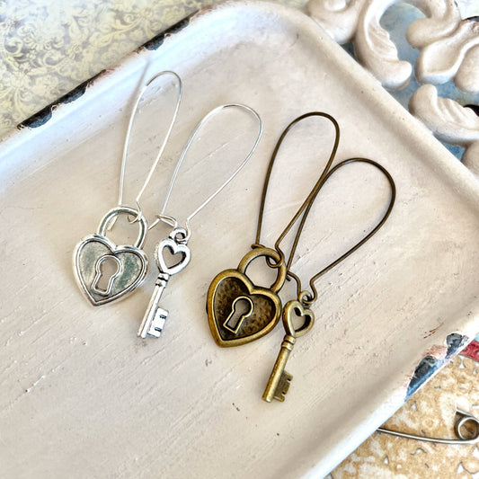 Asymmetrical lock and key charm earrings: Brass